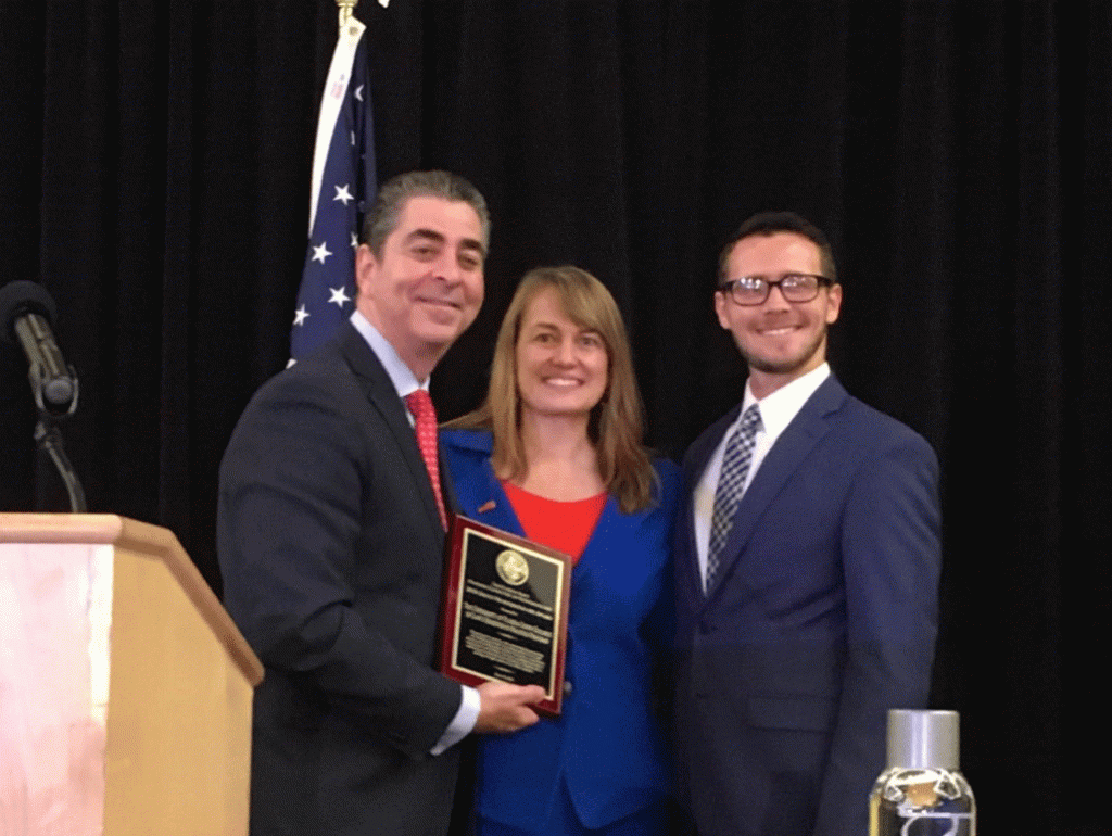 UF Law Dean Laura Rosenbury and UF Law alum Nate Harvey (JD 18) accept The Florida Bar’s Group Professionalism Award from Past President Michael Higer at The Florida Bar annual meeting on June 14, 2018.
