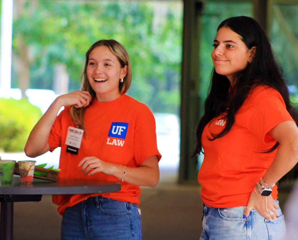 Two UF Ambassadors in orange shirts