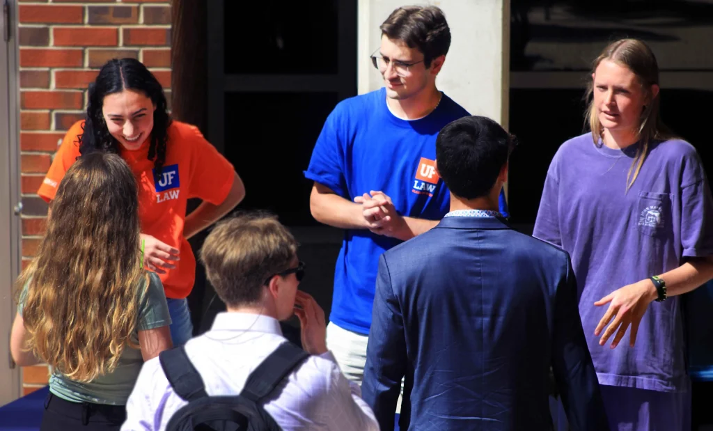Event attendees being greeted by ambassadors