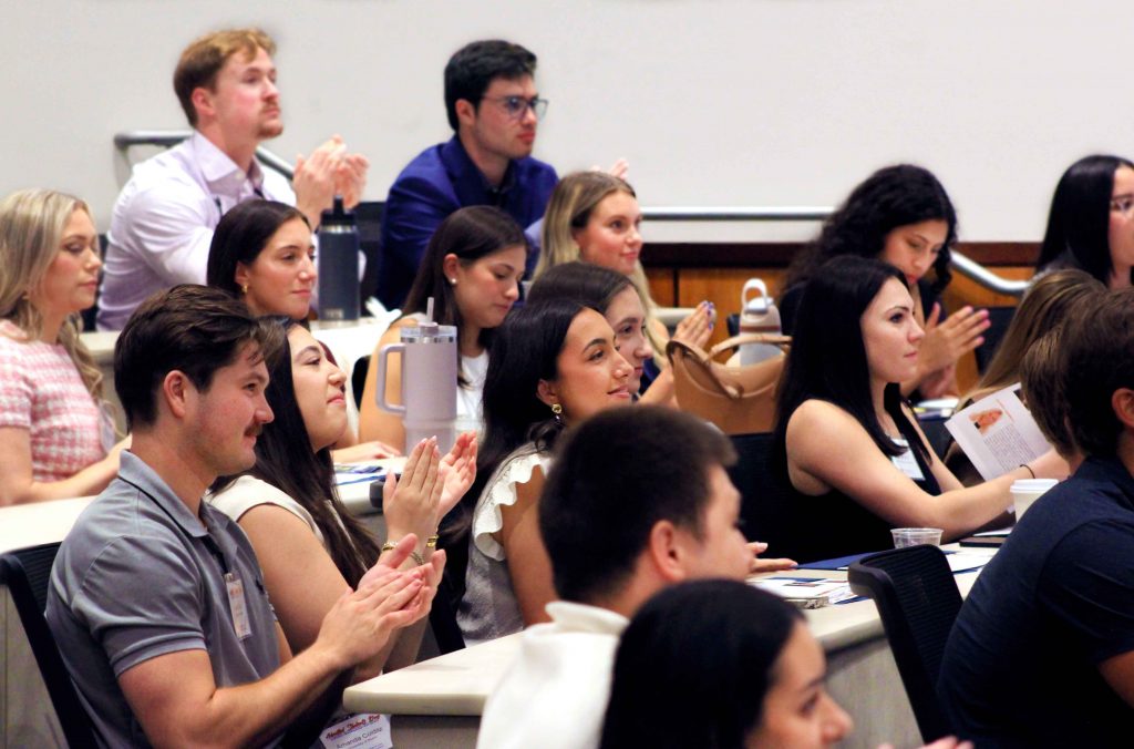 Event attendees applaud