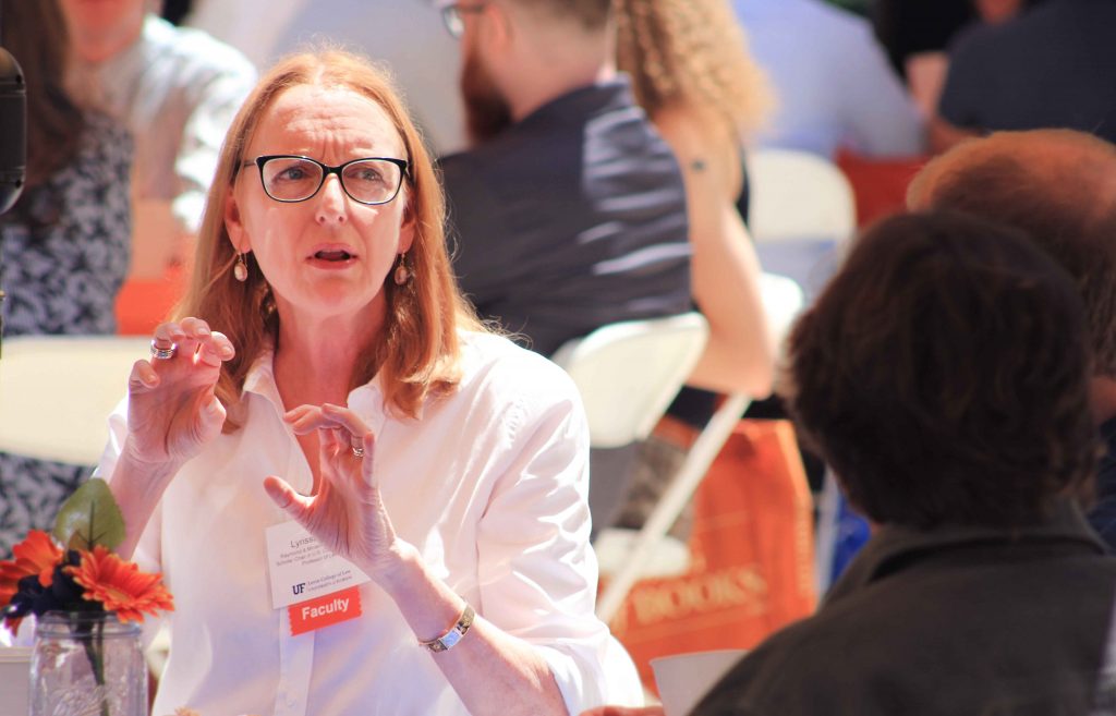 A faculty member mingles at the event