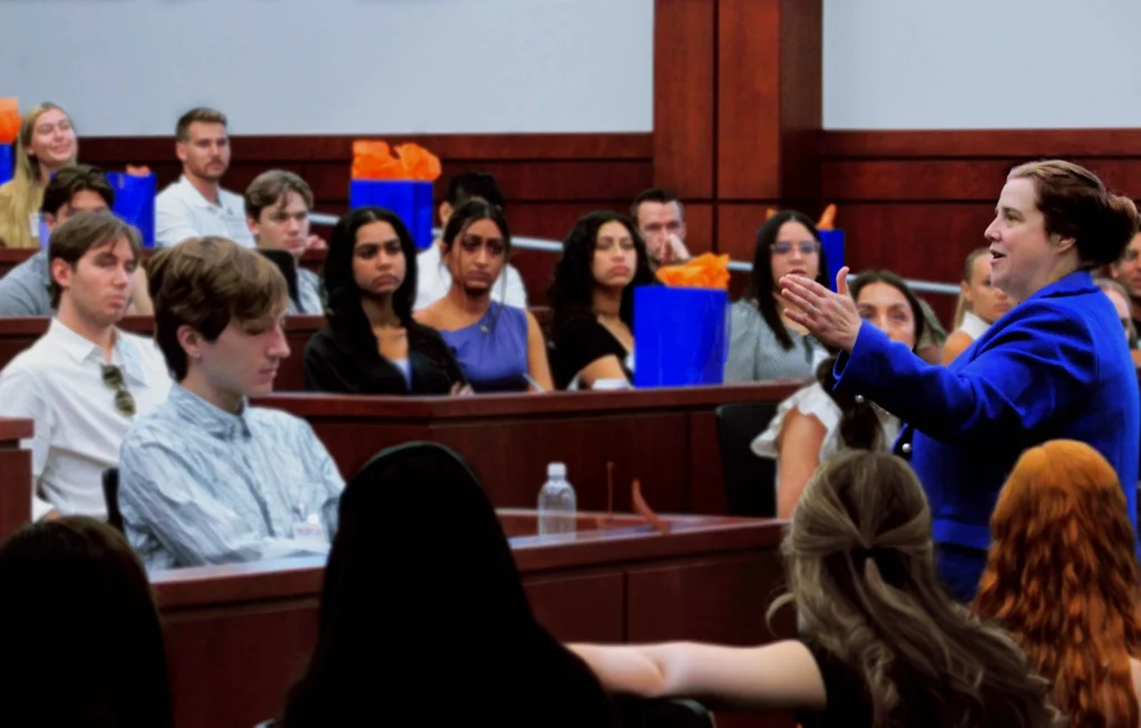 An individual speaks to event attendees