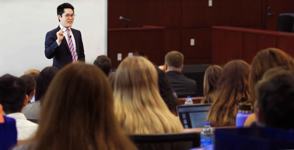 An individual speaks to event attendees