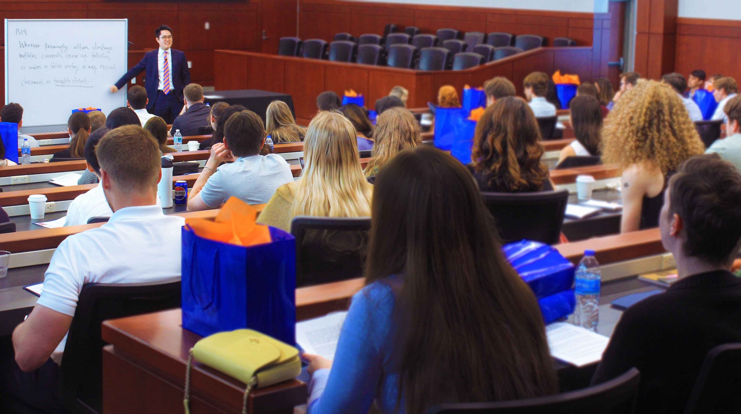 Event attendees listen to a speaker