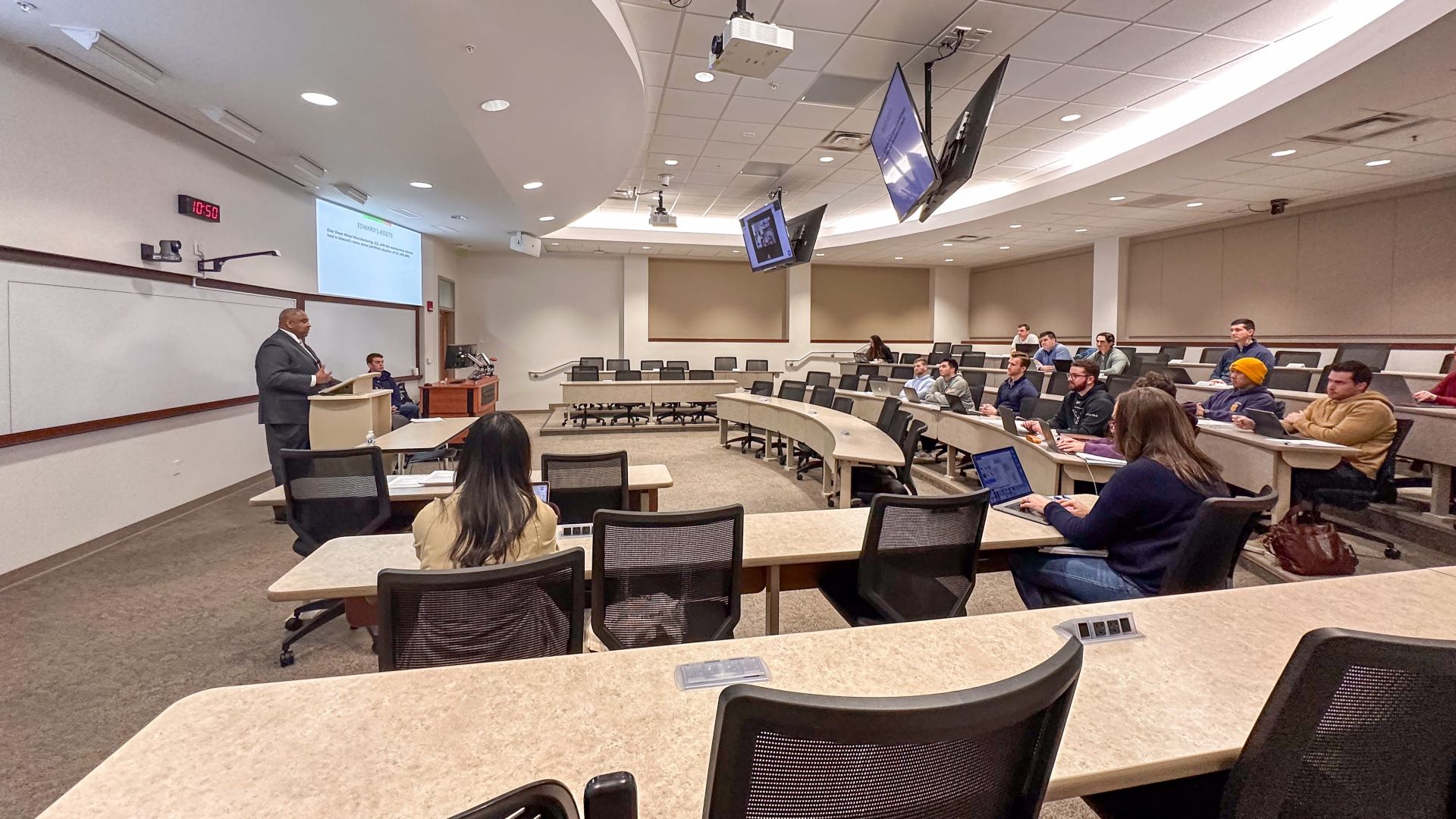 A professor teaches classroom of students