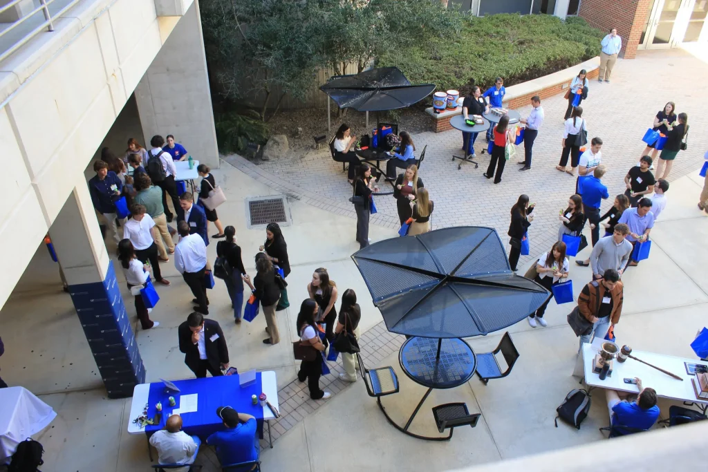 Aerial shot of event attendees mingling outside the building