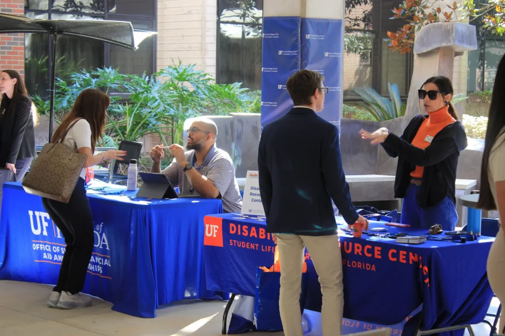 Event attendees visit tables of campus resources