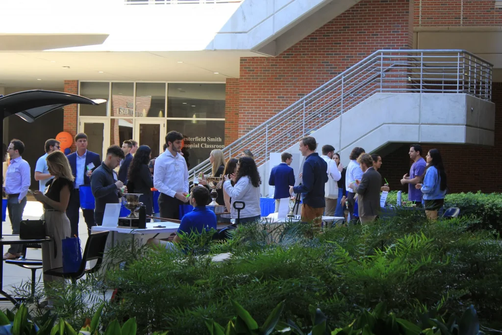 Event attendees mingle outside in building