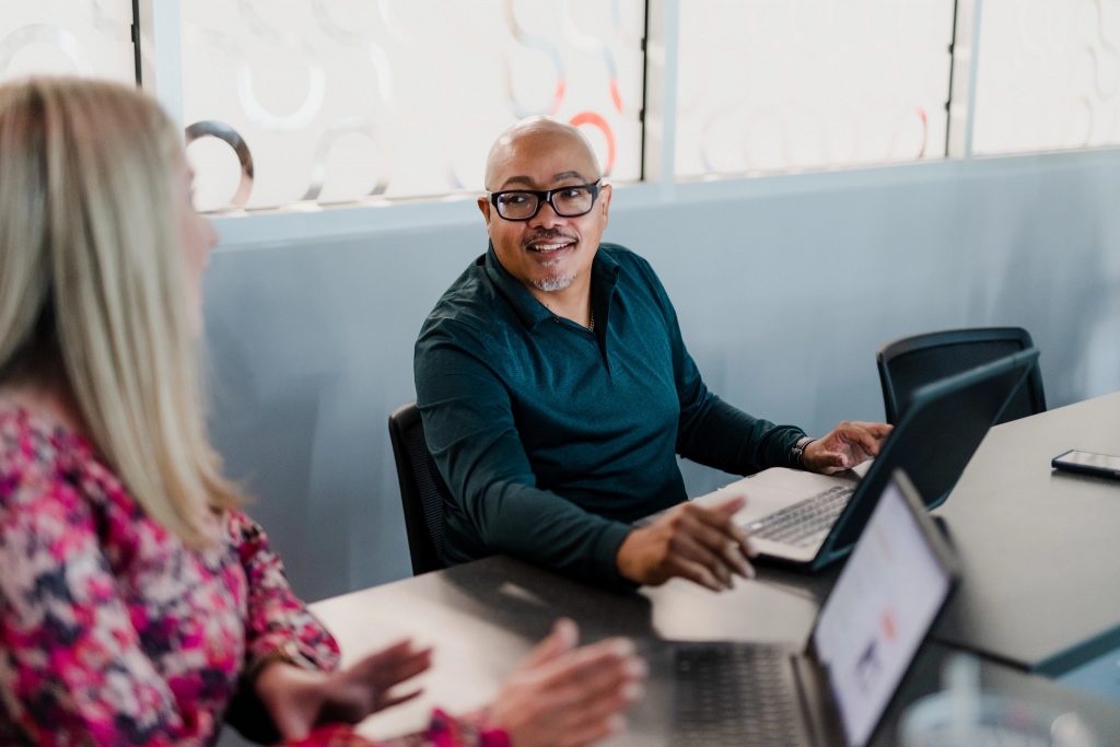 Mature students with laptops studying