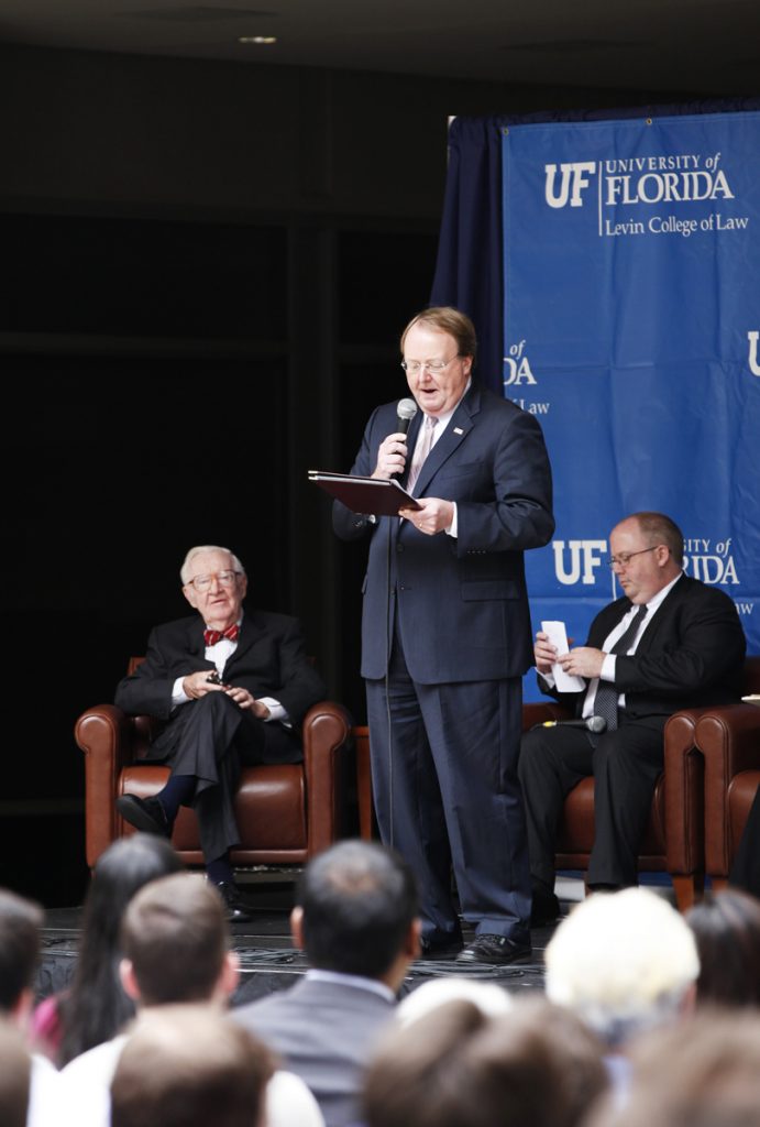 UF Law Dean Robert Jerry introduces Supreme Court Justice John Paul Stevens during the Marshall M. Criser Distinguised Lecture Series held in the Marcia Whitney Schott Courtyard on Tuesday, Feb. 5, 2013. (photo by Elise Giordano)