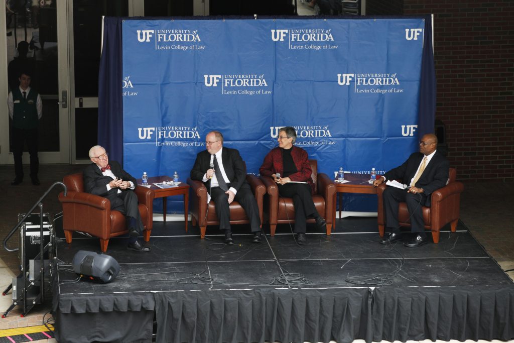 Supreme Court Justice John Paul Stevens speaks with UF Law professors Kenneth Nunn, John Stinneford and Danaya Wright during the Marshall M. Criser Distinguished Lecture Series held in the Marcia Whitney Schott Courtyard on Tuesday, Feb. 5, 2013. (photo by Elise Giordano)