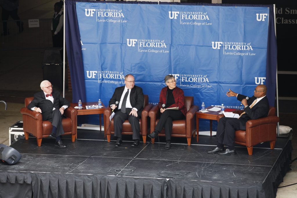 Supreme Court Justice John Paul Stevens speaks with UF Law professors Kenneth Nunn, John Stinneford and Danaya Wright during the Marshall M. Criser Distinguished Lecture Series held in the Marcia Whitney Schott Courtyard on Tuesday, Feb. 5, 2013. (photo by Elise Giordano)