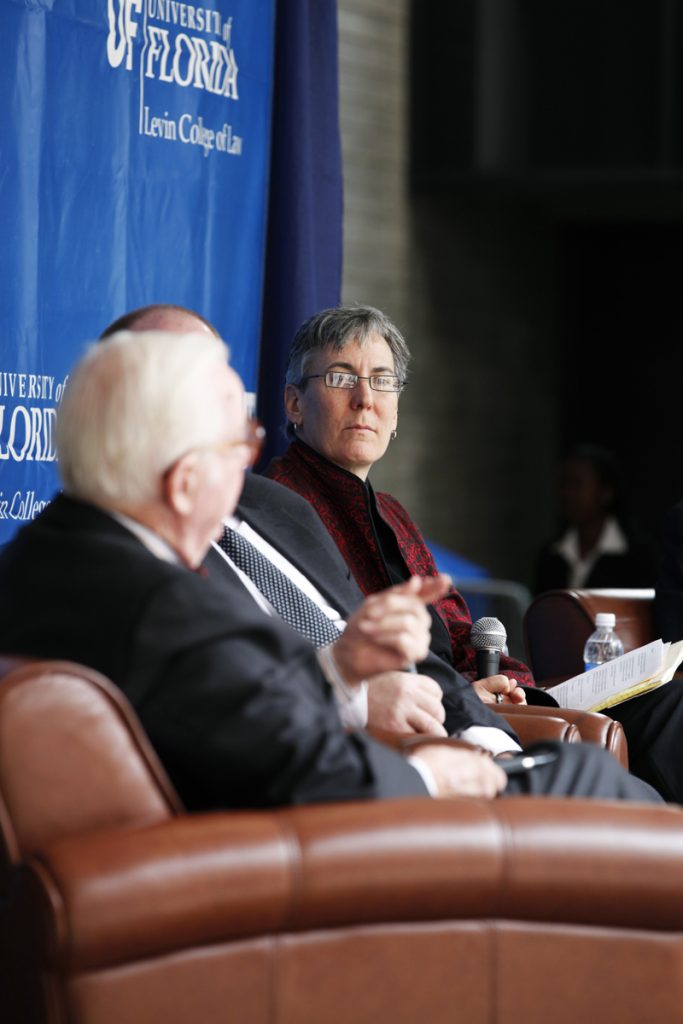 UF Law professor Danaya Wright, along with UF Law professors Kenneth Nunn and Danaya Wright, listen to Supreme Court Justice John Paul Stevens, during the Marshall M. Criser Distinguished Lecture Series held in the Marcia Whitney Schott Courtyard on Tuesday, Feb. 5, 2013. (photo by Elise Giordano)