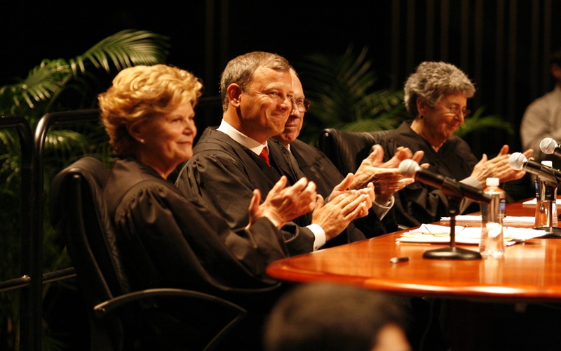 Chief Justice John Roberts helps judge a moot court competition at UF Law