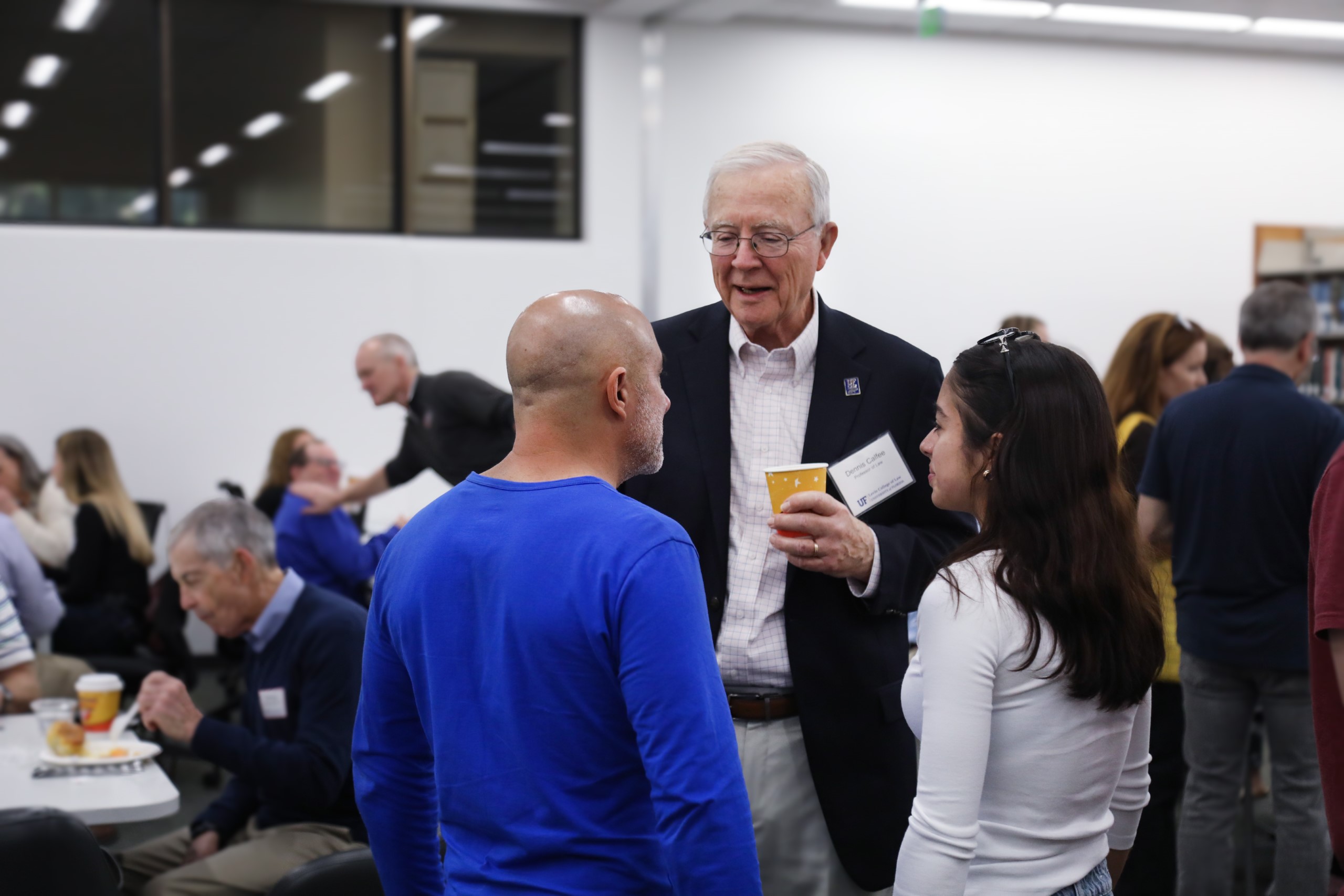A celebratory brunch was held at UF Law in honor of Professor Dennis Calfee and his 50 years of service to the law school. Attendees enjoyed food and conversation on Saturday, November 16 as Professor Calfee took time to speak with guests.