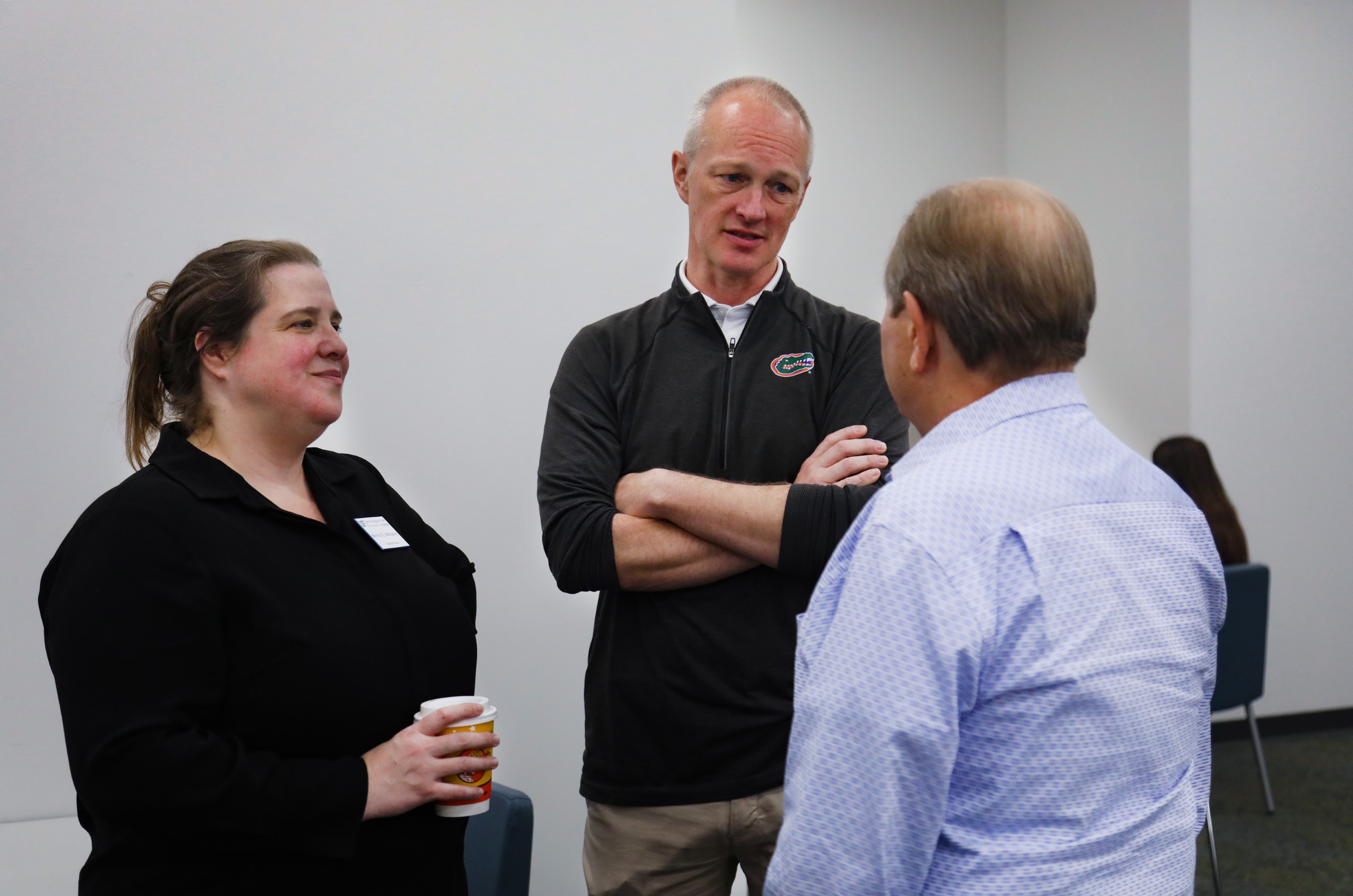 Dean Merritt McAlister and Senior Associate Dean and Chief of Staff Joe Mandernach talk with guests at the celebratory brunch held at UF Law in honor of Professor Dennis Calfee and his 50 years of service to the law school.