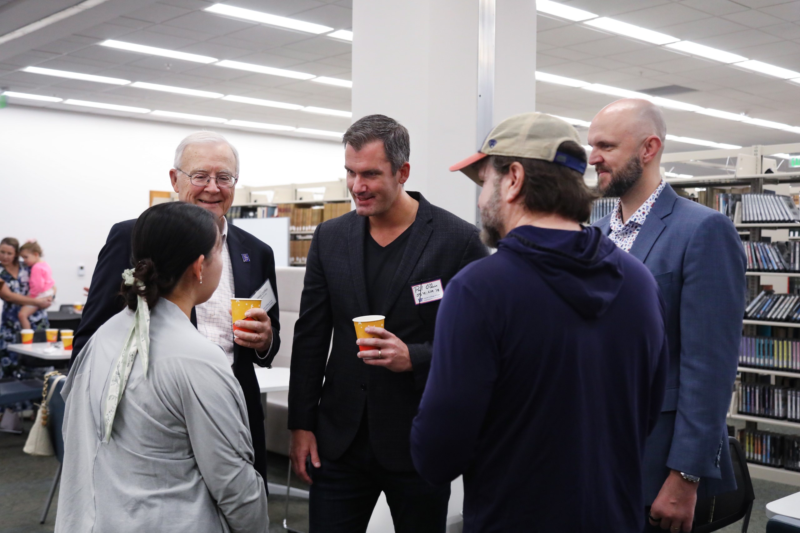 Professor Dennis Calfee talks with guests at a celebratory brunch hosted at UF Law in honor of his 50 years of service to the law school on November 16.