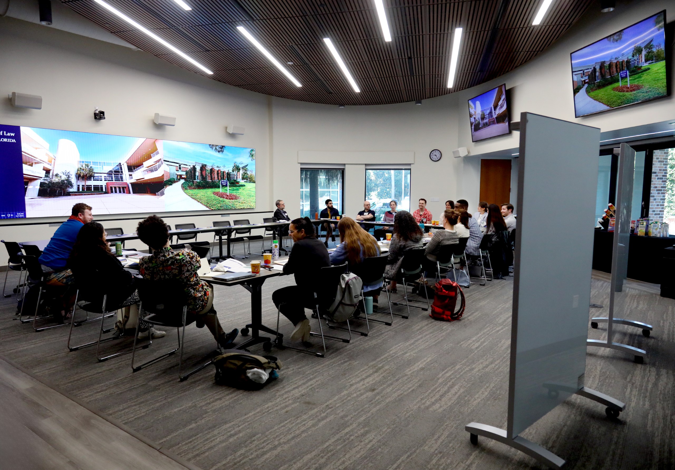 Scholars and faculty members gather inside Bailey Event Space for the Junior Law Conference at UF Law on November 7. 