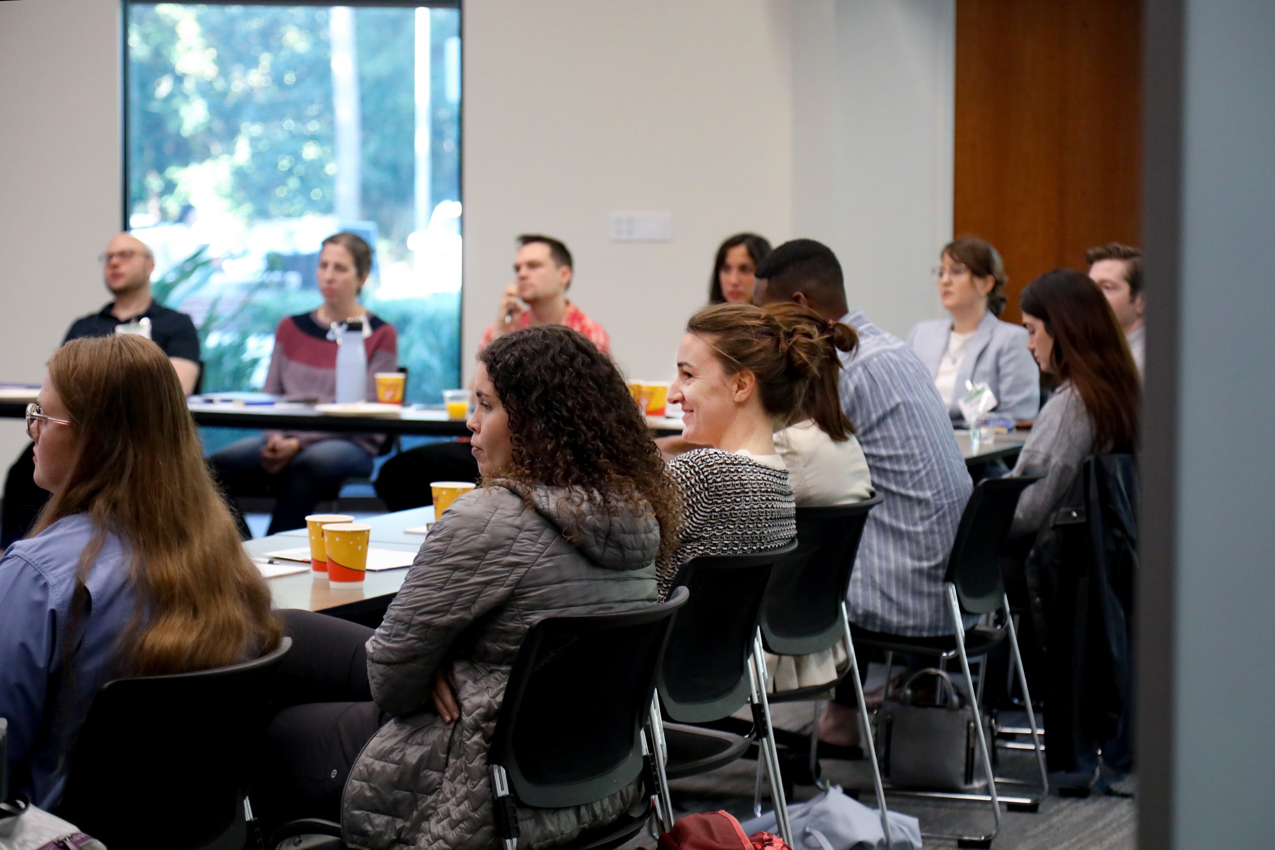 Scholars and faculty members gather inside Bailey Event Space for the Junior Law Conference at UF Law on November 7. 