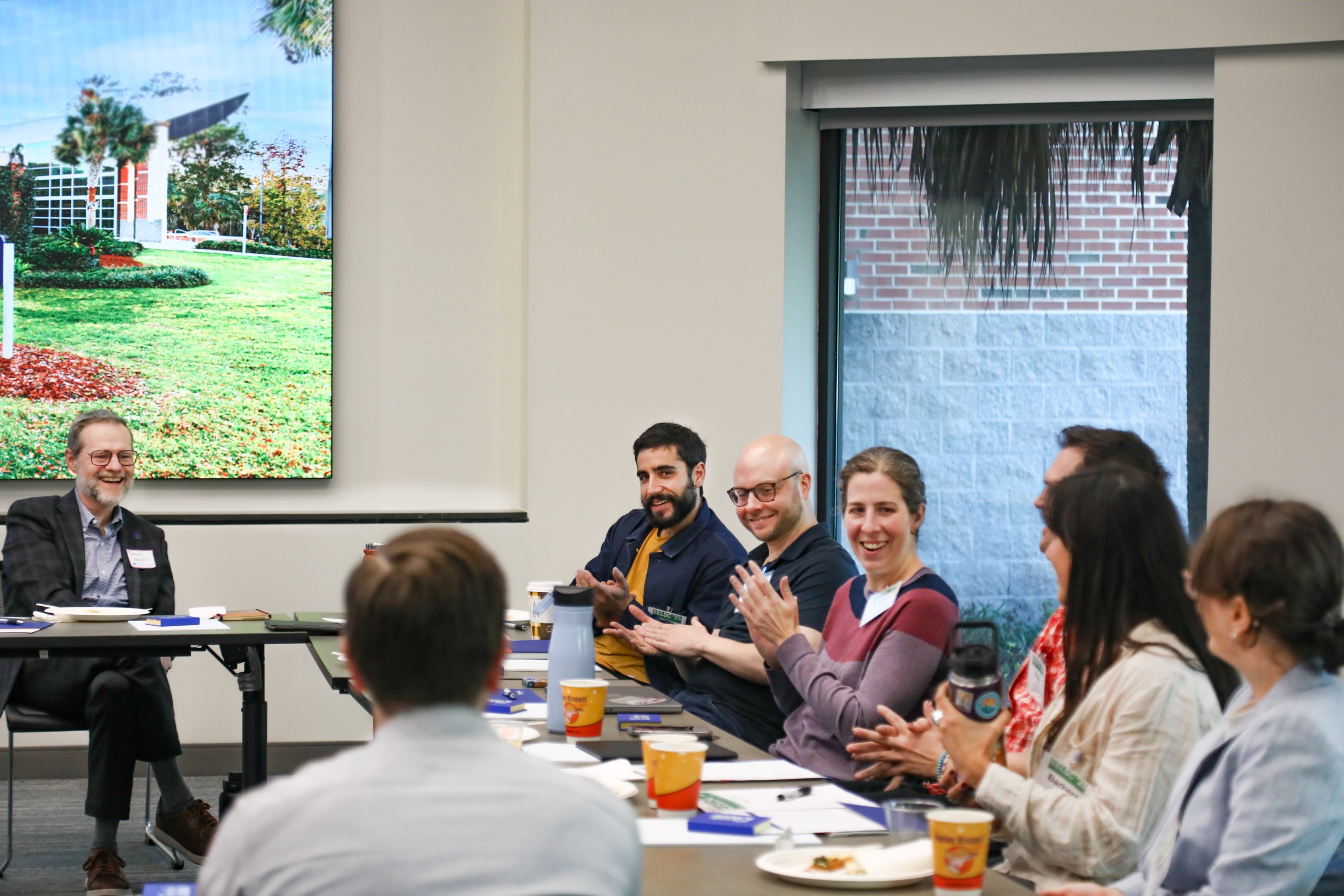 Scholars and faculty members gather inside Bailey Event Space for the Junior Law Conference at UF Law on November 7. 