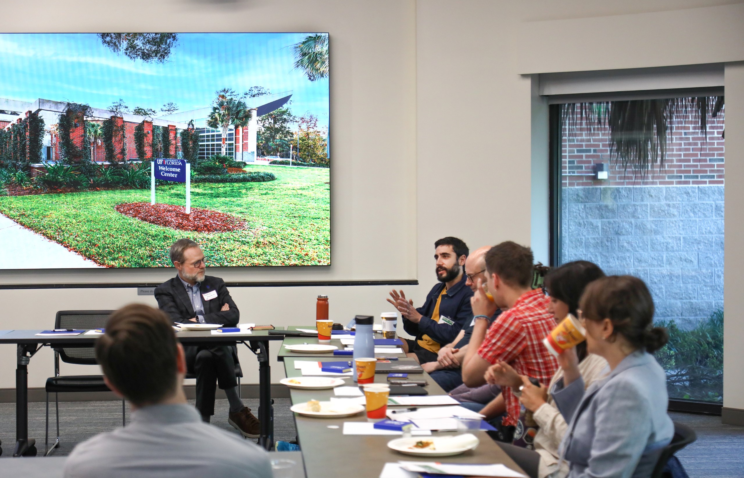 Scholars and faculty members gather inside Bailey Event Space for the Junior Law Conference at UF Law on November 7. 