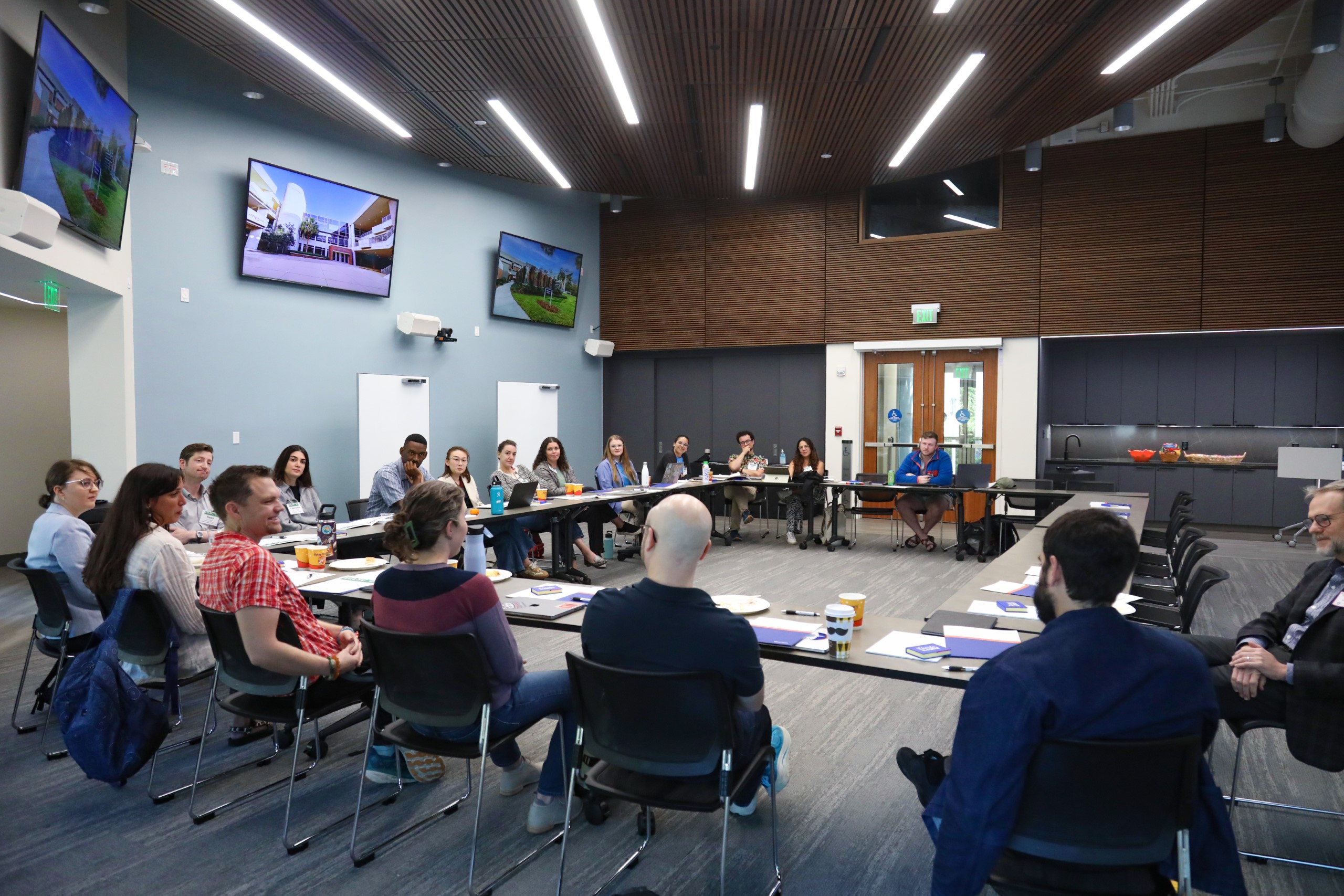 Scholars and faculty members gather inside Bailey Event Space for the Junior Law Conference at UF Law on November 7. 