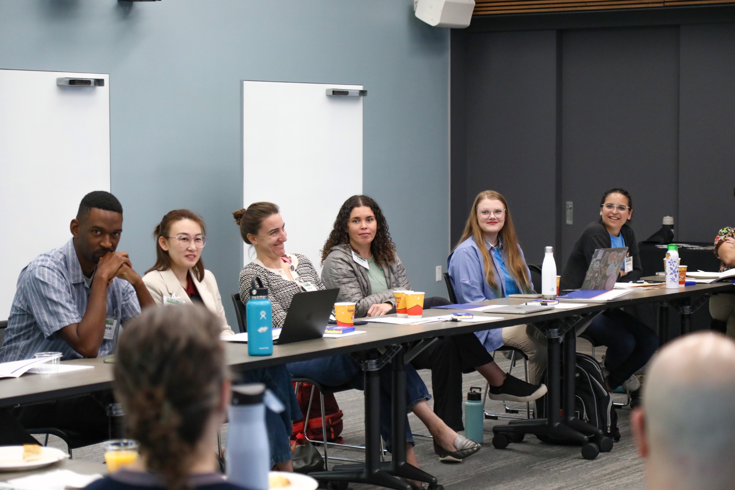 Scholars and faculty members gather inside Bailey Event Space for the Junior Law Conference at UF Law on November 7. 