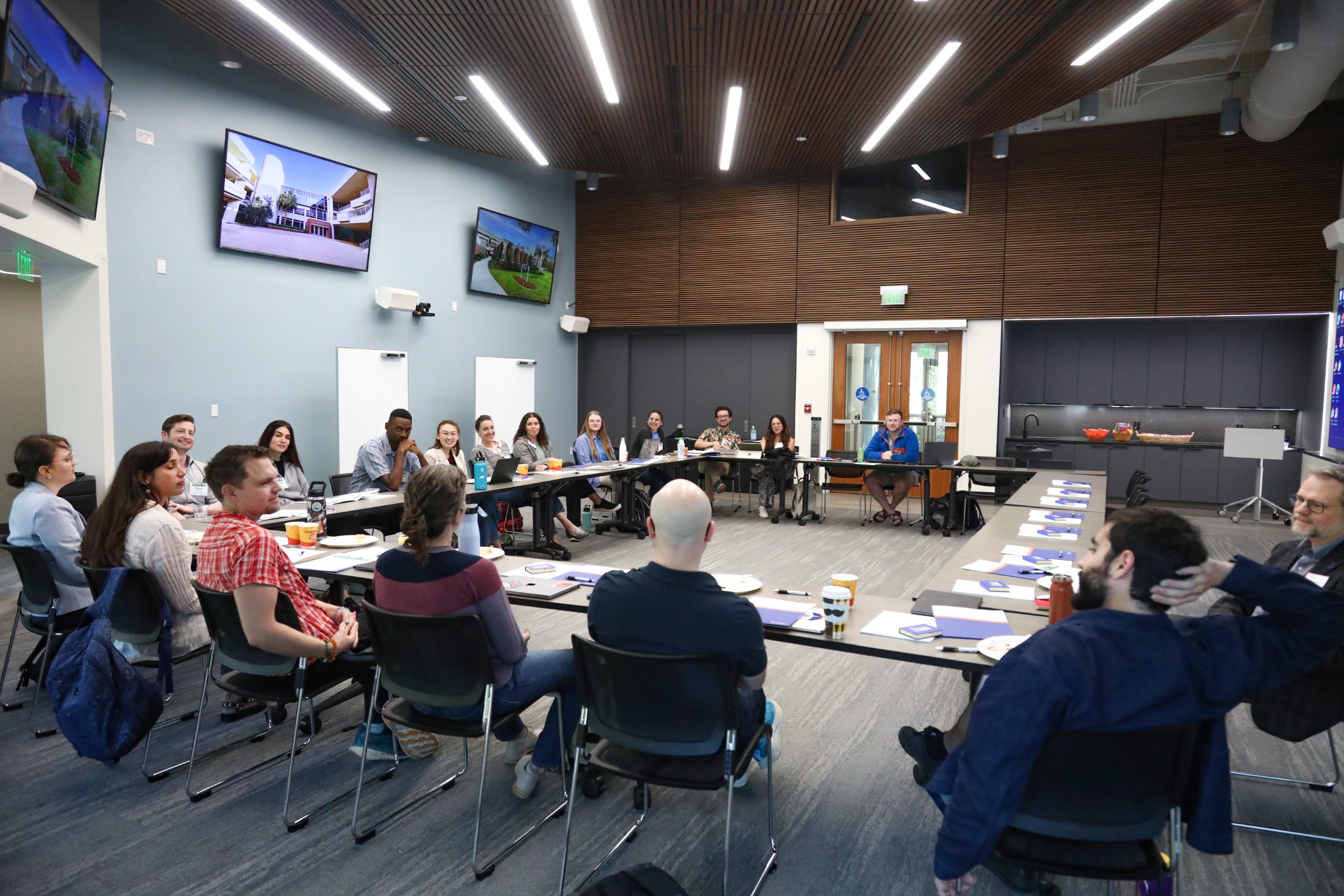 Scholars and faculty members gather inside Bailey Event Space for the Junior Law Conference at UF Law on November 7. 