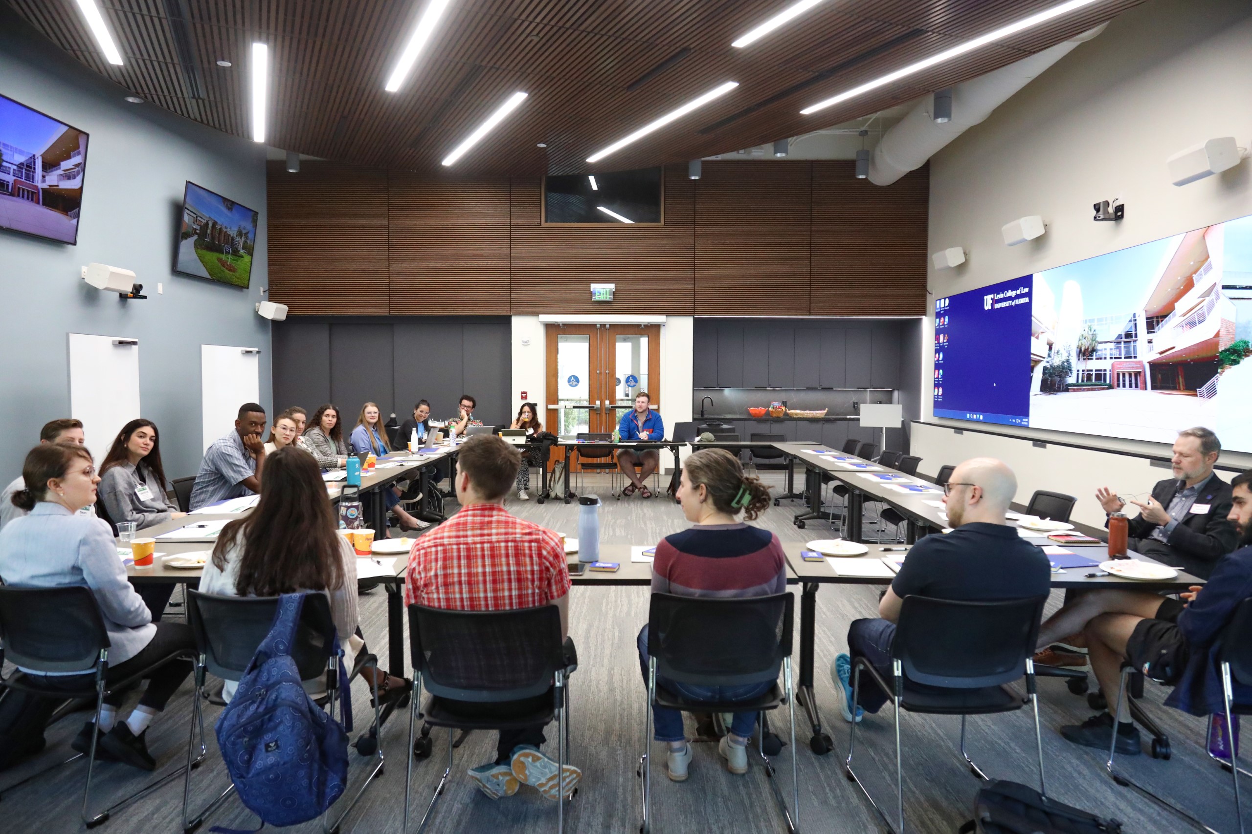 Scholars and faculty members gather inside Bailey Event Space for the Junior Law Conference at UF Law on November 7.