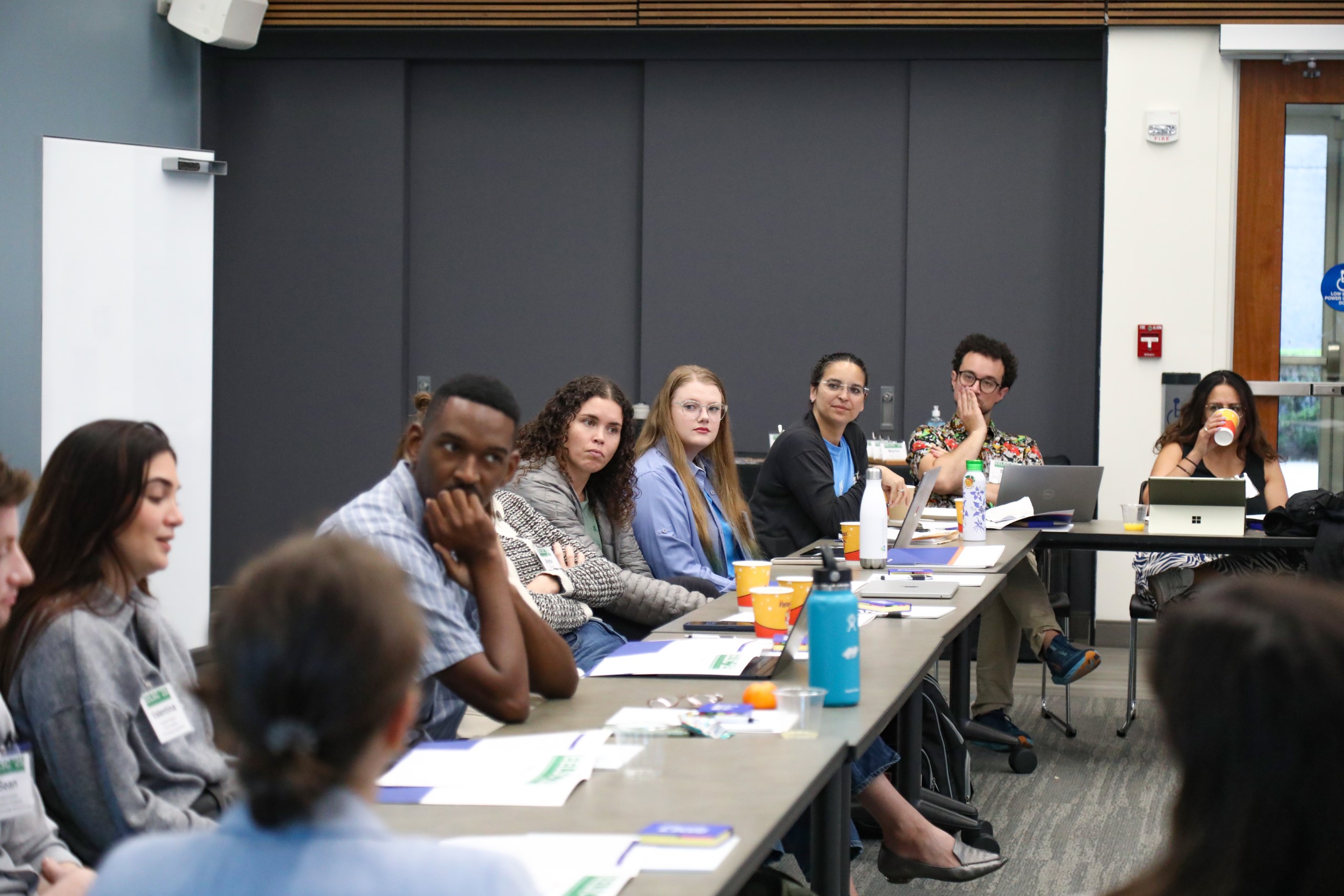 Scholars and faculty members gather inside Bailey Event Space for the Junior Law Conference at UF Law on November 7. 