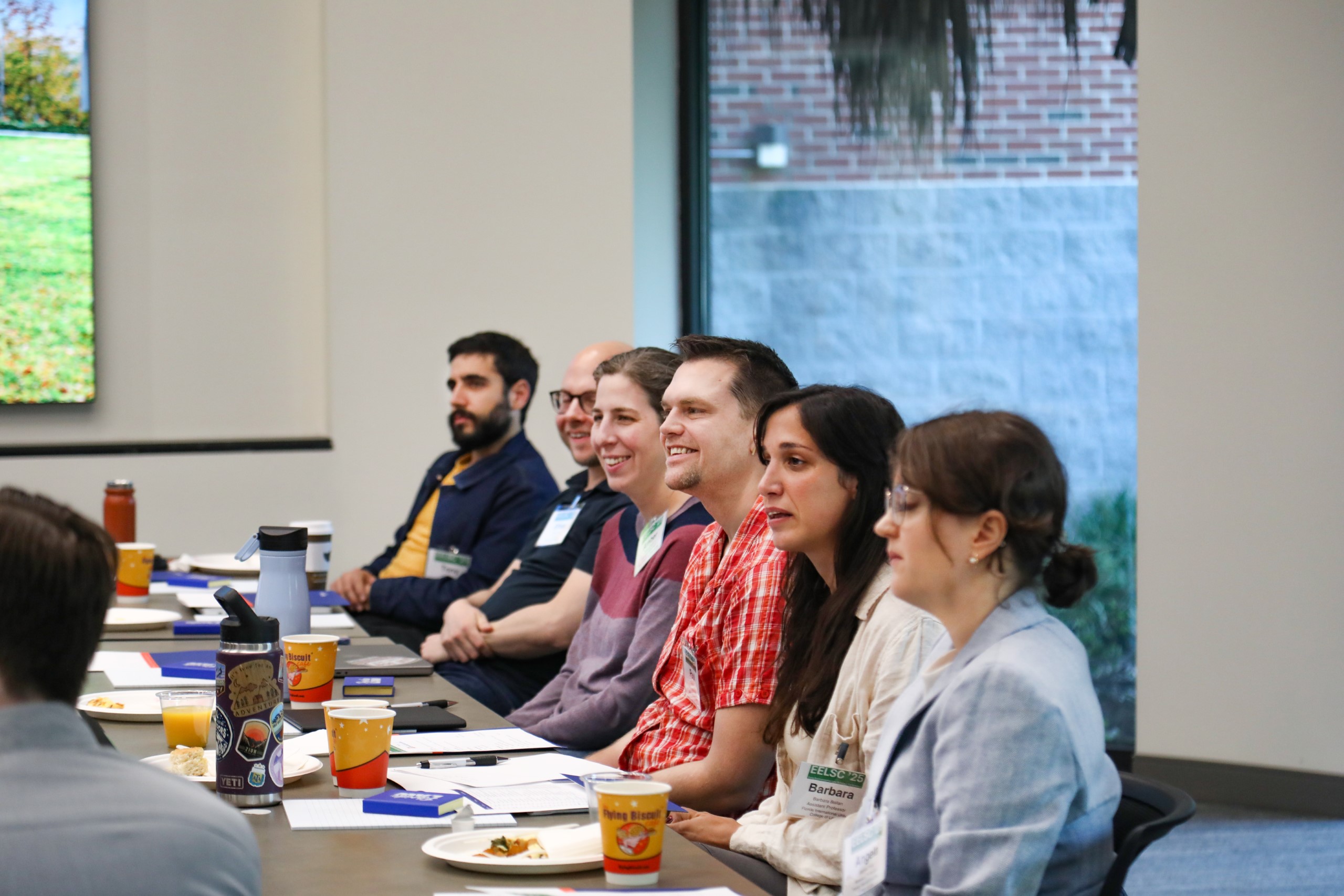 Scholars and faculty members gather inside Bailey Event Space for the Junior Law Conference at UF Law on November 7. 