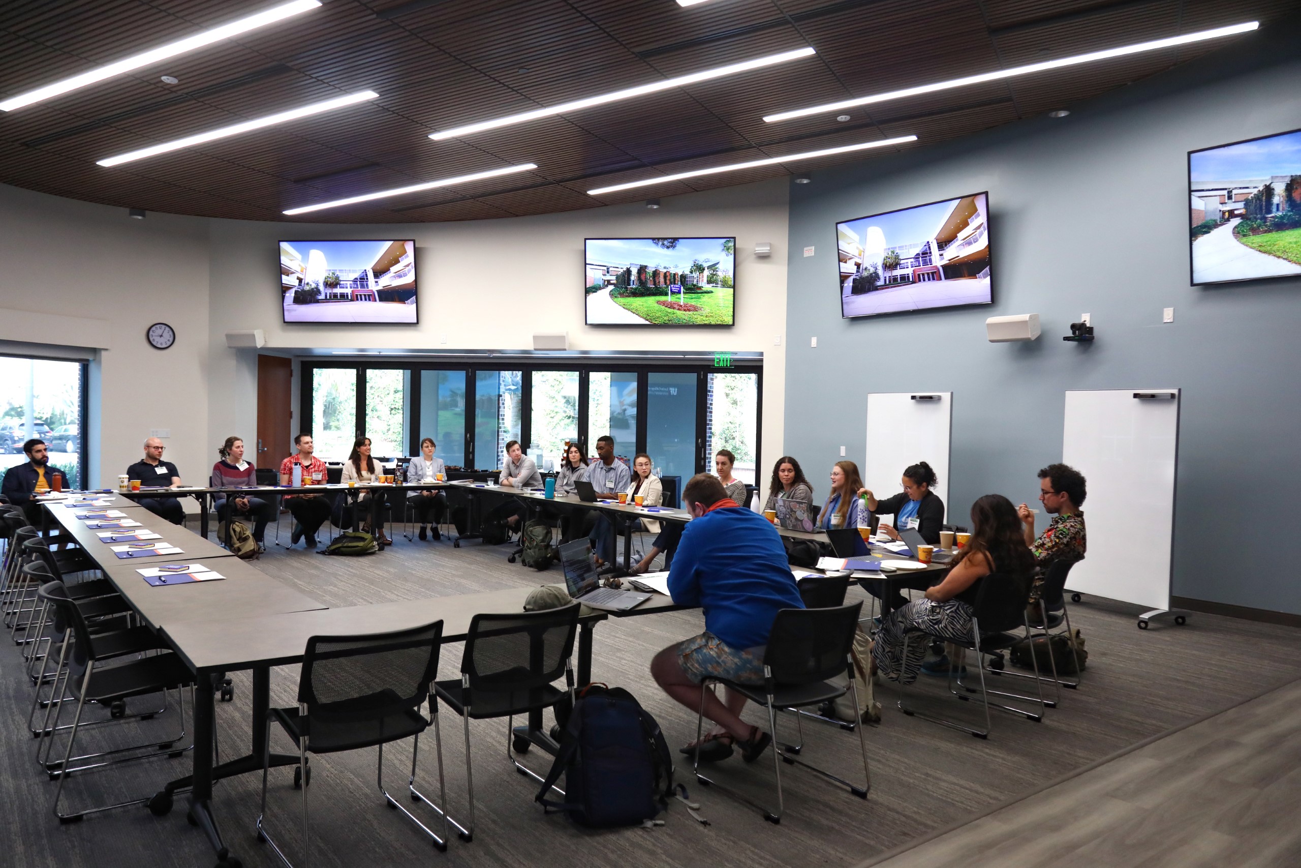 Scholars and faculty members gather inside Bailey Event Space for the Junior Law Conference at UF Law on November 7. 