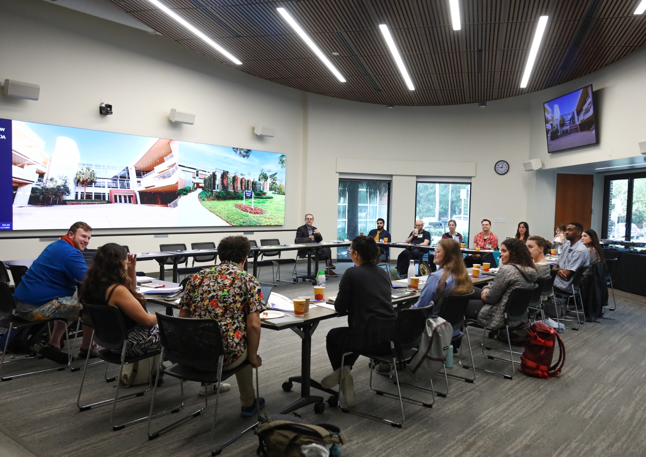 Scholars and faculty members gather inside Bailey Event Space for the Junior Law Conference at UF Law on November 7. 