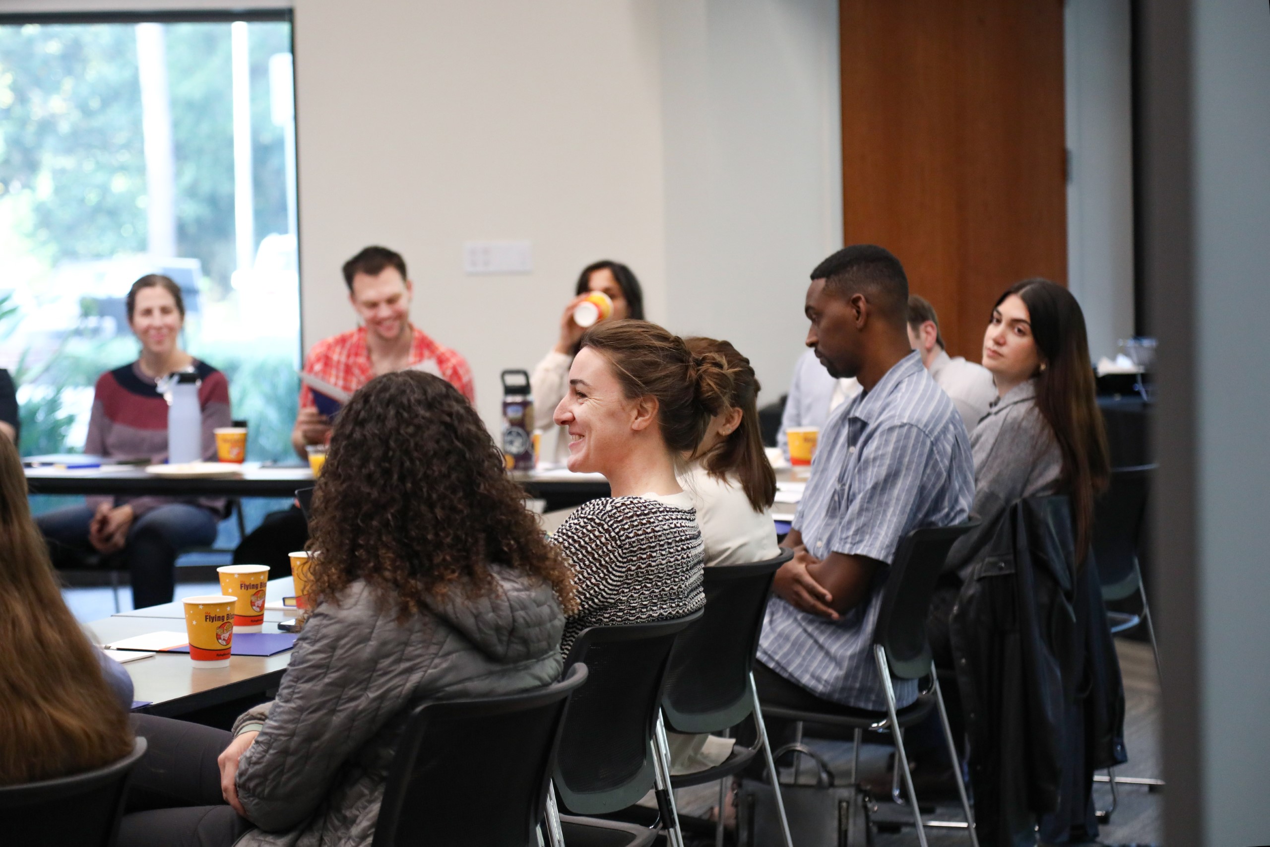 Scholars and faculty members gather inside Bailey Event Space for the Junior Law Conference at UF Law on November 7. 