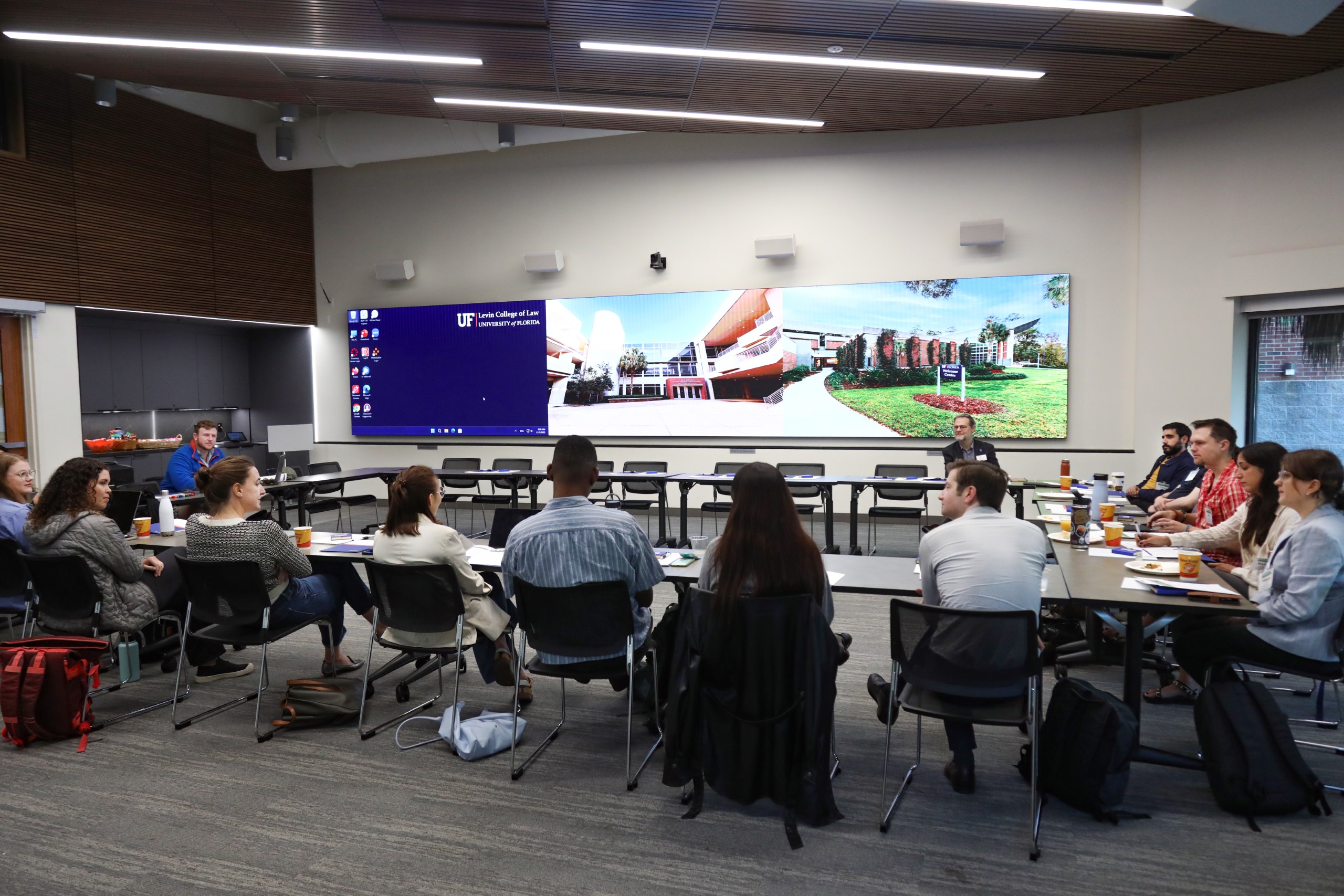 Scholars and faculty members gather inside Bailey Event Space for the Junior Law Conference at UF Law on November 7. 