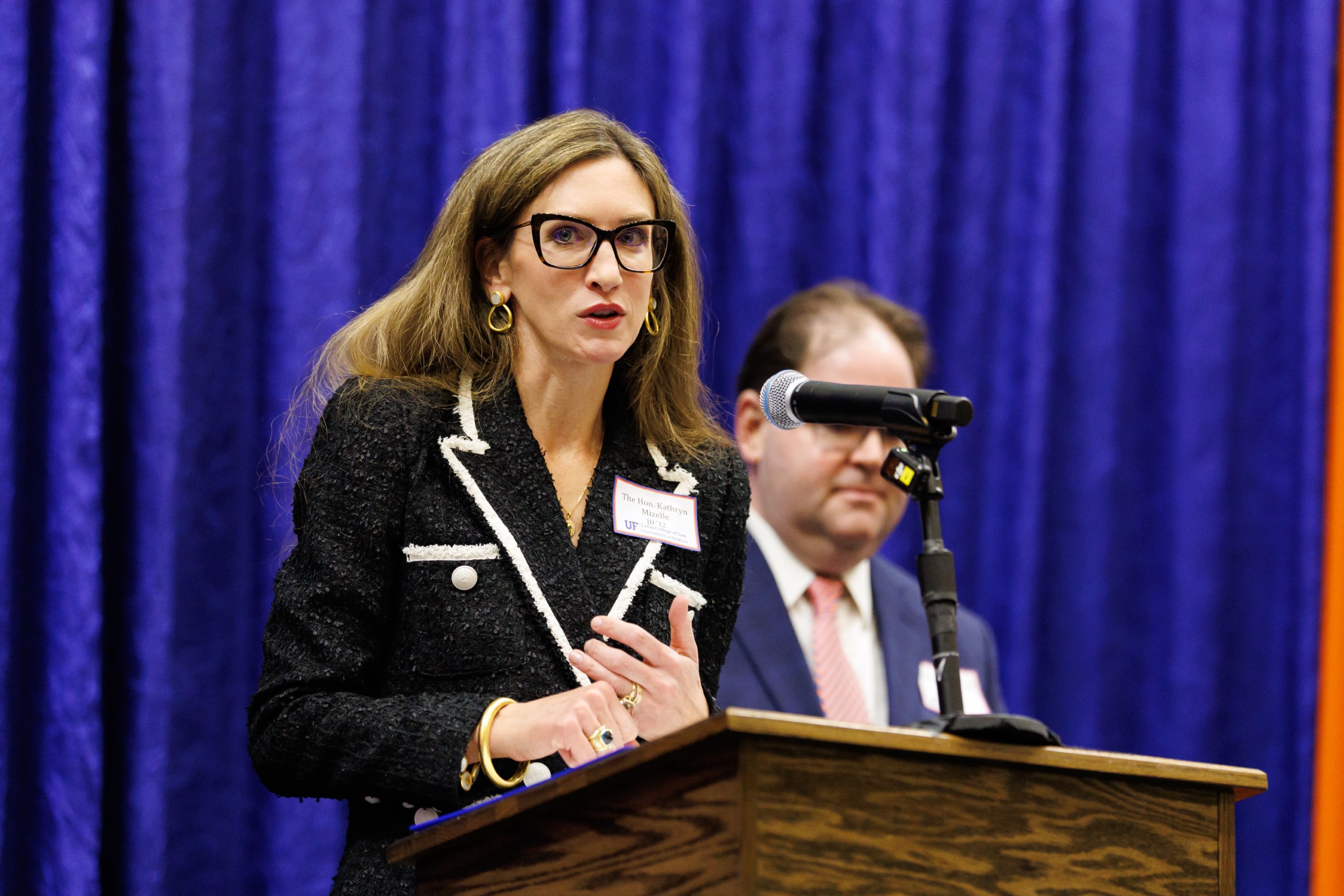 Judge Kathryn Kimball Mizelle (JD 12), District Judge, U.S. District Court for the Middle District of Florida, speaks at the celebration reception for UF Law's Professor Dennis Calfee and his 50 years of service to the law school. Judge Kimball and Judge Robert Luck (JD 04), U.S. Circuit Judge, U.S. Court of Appeals for the 11th Circuit, served as the Masters of Ceremony at the Friday, November 15 event.