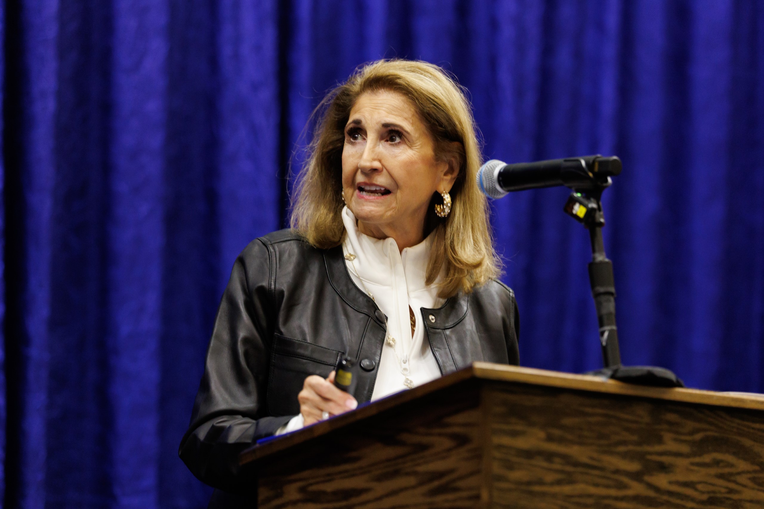 Guest speakers address the audience at the celebration reception for UF Law's Professor Dennis Calfee and his 50 years of service to the law school. The celebration was held on Friday, November 15 at the University of Florida's Champions Club at Ben Hill Griffin Stadium. The reception included a welcome from Dean Merritt McAlister, and remarks from Masters of Ceremony Judge Robert Luck (JD 04), U.S. Circuit Judge, U.S. Court of Appeals for the 11th Circuit, and Judge Kathryn Kimball Mizelle (JD 12), District Judge, U.S. District Court for the Middle District of Florida. Additional guest speakers reflected on Professor Calfee's 50 year career and the impact that he has had at UF Law and beyond. After recognitions and presentations, Judge Luck and Judge Mizelle made the closing remarks.