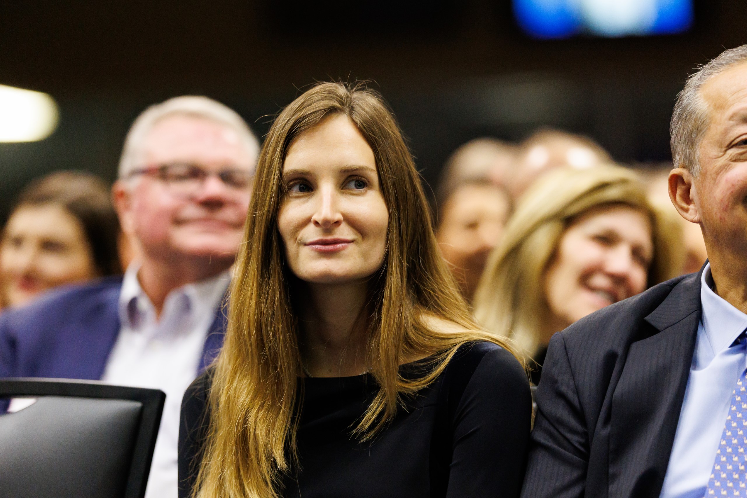 Guests smile as they listen to the speakers at the celebration reception for UF Law's Professor Dennis Calfee and his 50 years of service to the law school. The celebration was held on Friday, November 15 at the University of Florida's Champions Club at Ben Hill Griffin Stadium. The reception included a welcome from Dean Merritt McAlister, and remarks from Masters of Ceremony Judge Robert Luck (JD 04), U.S. Circuit Judge, U.S. Court of Appeals for the 11th Circuit, and Judge Kathryn Kimball Mizelle (JD 12), District Judge, U.S. District Court for the Middle District of Florida. Additional guest speakers reflected on Professor Calfee's 50 year career and the impact that he has had at UF Law and beyond. After recognitions and presentations, Judge Luck and Judge Mizelle made the closing remarks.