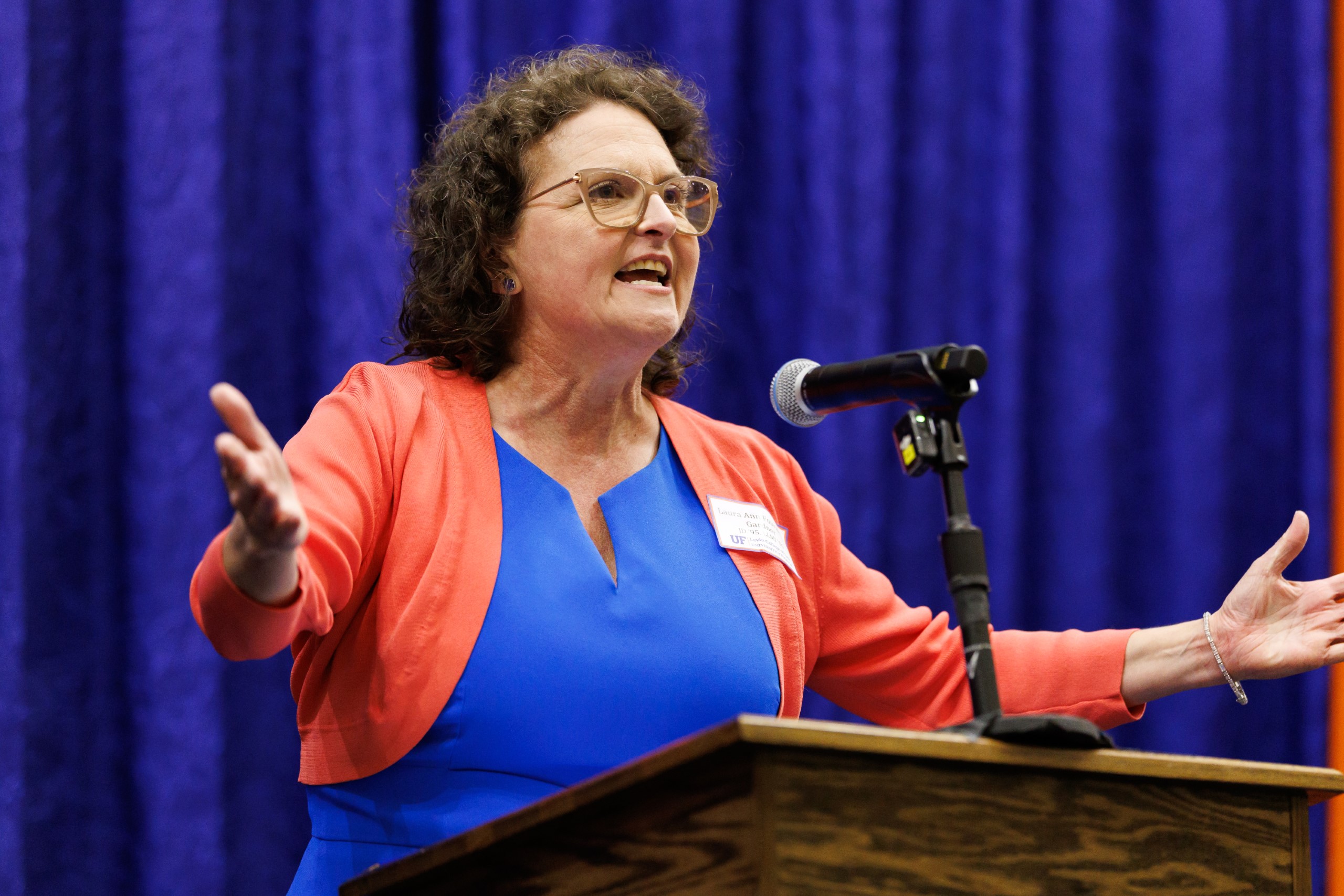 Guest speakers address the audience at the celebration reception for UF Law's Professor Dennis Calfee and his 50 years of service to the law school. The celebration was held on Friday, November 15 at the University of Florida's Champions Club at Ben Hill Griffin Stadium. The reception included a welcome from Dean Merritt McAlister, and remarks from Masters of Ceremony Judge Robert Luck (JD 04), U.S. Circuit Judge, U.S. Court of Appeals for the 11th Circuit, and Judge Kathryn Kimball Mizelle (JD 12), District Judge, U.S. District Court for the Middle District of Florida. Additional guest speakers reflected on Professor Calfee's 50 year career and the impact that he has had at UF Law and beyond. After recognitions and presentations, Judge Luck and Judge Mizelle made the closing remarks.