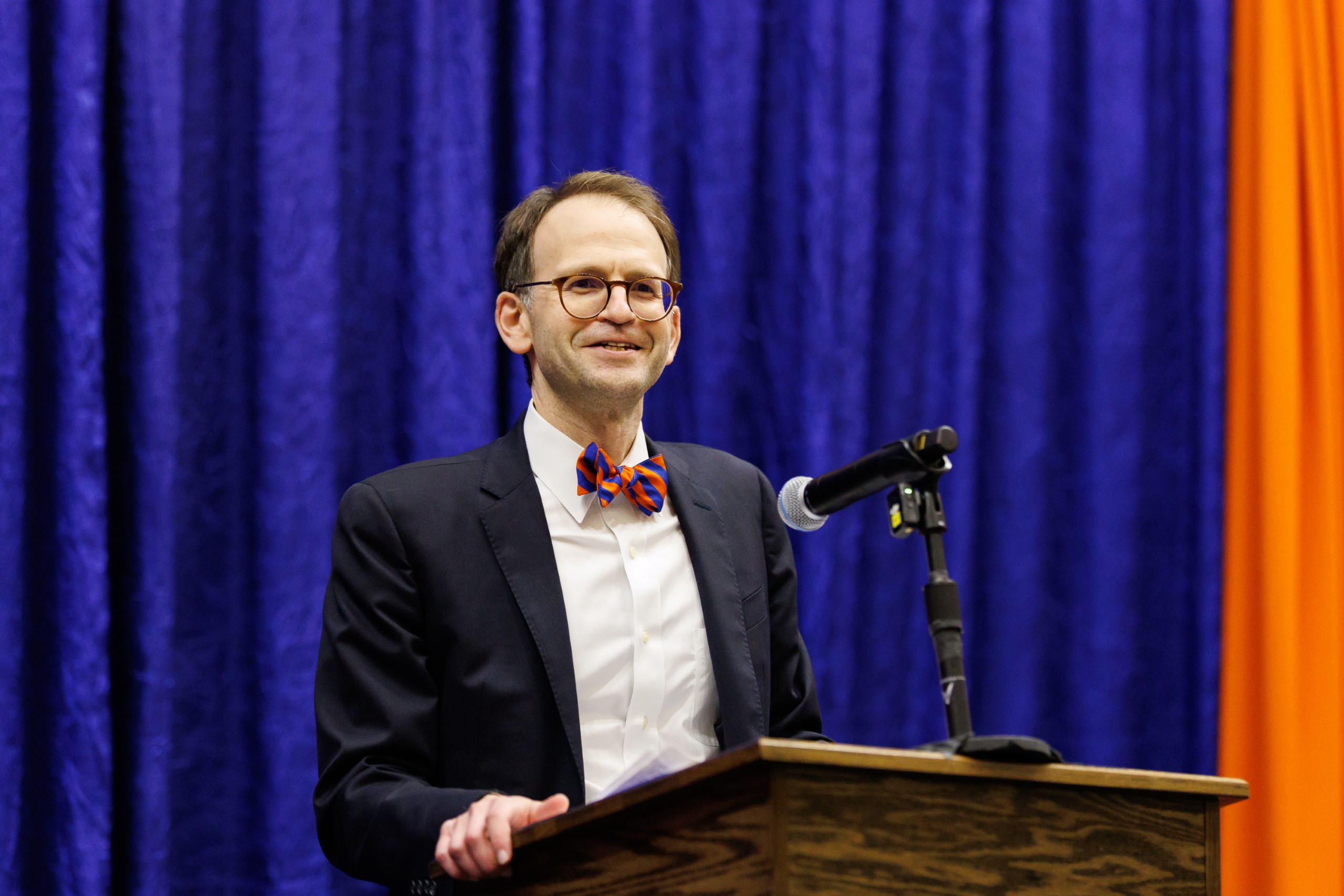 Guest speakers address the audience at the celebration reception for UF Law's Professor Dennis Calfee and his 50 years of service to the law school. The celebration was held on Friday, November 15 at the University of Florida's Champions Club at Ben Hill Griffin Stadium. The reception included a welcome from Dean Merritt McAlister, and remarks from Masters of Ceremony Judge Robert Luck (JD 04), U.S. Circuit Judge, U.S. Court of Appeals for the 11th Circuit, and Judge Kathryn Kimball Mizelle (JD 12), District Judge, U.S. District Court for the Middle District of Florida. Additional guest speakers reflected on Professor Calfee's 50 year career and the impact that he has had at UF Law and beyond. After recognitions and presentations, Judge Luck and Judge Mizelle made the closing remarks.