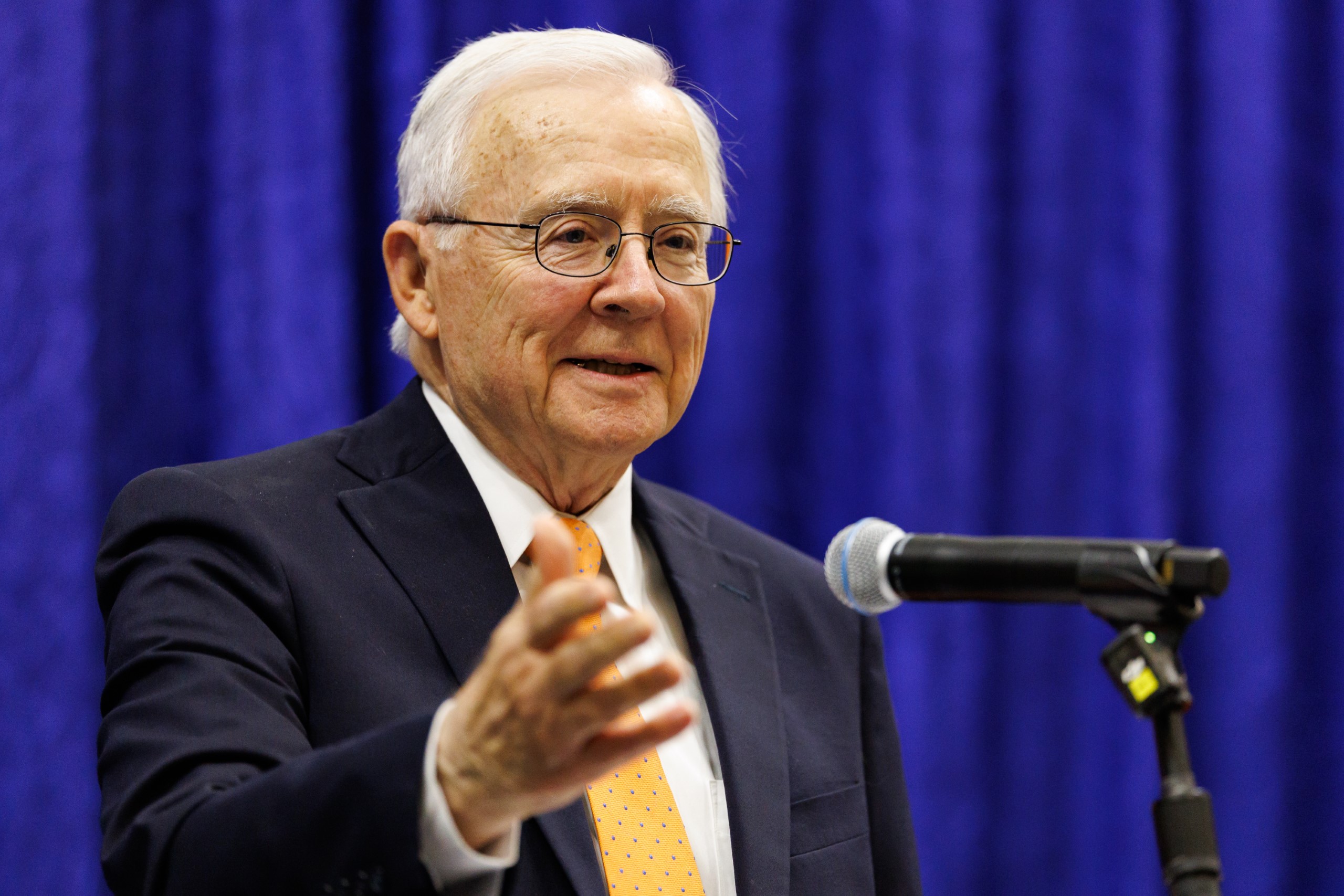 UF Law Professor Dennis Calfee speaks at his celebration reception for his 50 years of service to the law school. The celebration was held on Friday, November 15 at the University of Florida's Champions Club at Ben Hill Griffin Stadium. The reception included a welcome from Dean Merritt McAlister, and remarks from Masters of Ceremony Judge Robert Luck (JD 04), U.S. Circuit Judge, U.S. Court of Appeals for the 11th Circuit, and Judge Kathryn Kimball Mizelle (JD 12), District Judge, U.S. District Court for the Middle District of Florida. Additional guest speakers reflected on Professor Calfee's 50 year career and the impact that he has had at UF Law and beyond. After recognitions and presentations, Judge Luck and Judge Mizelle made the closing remarks.