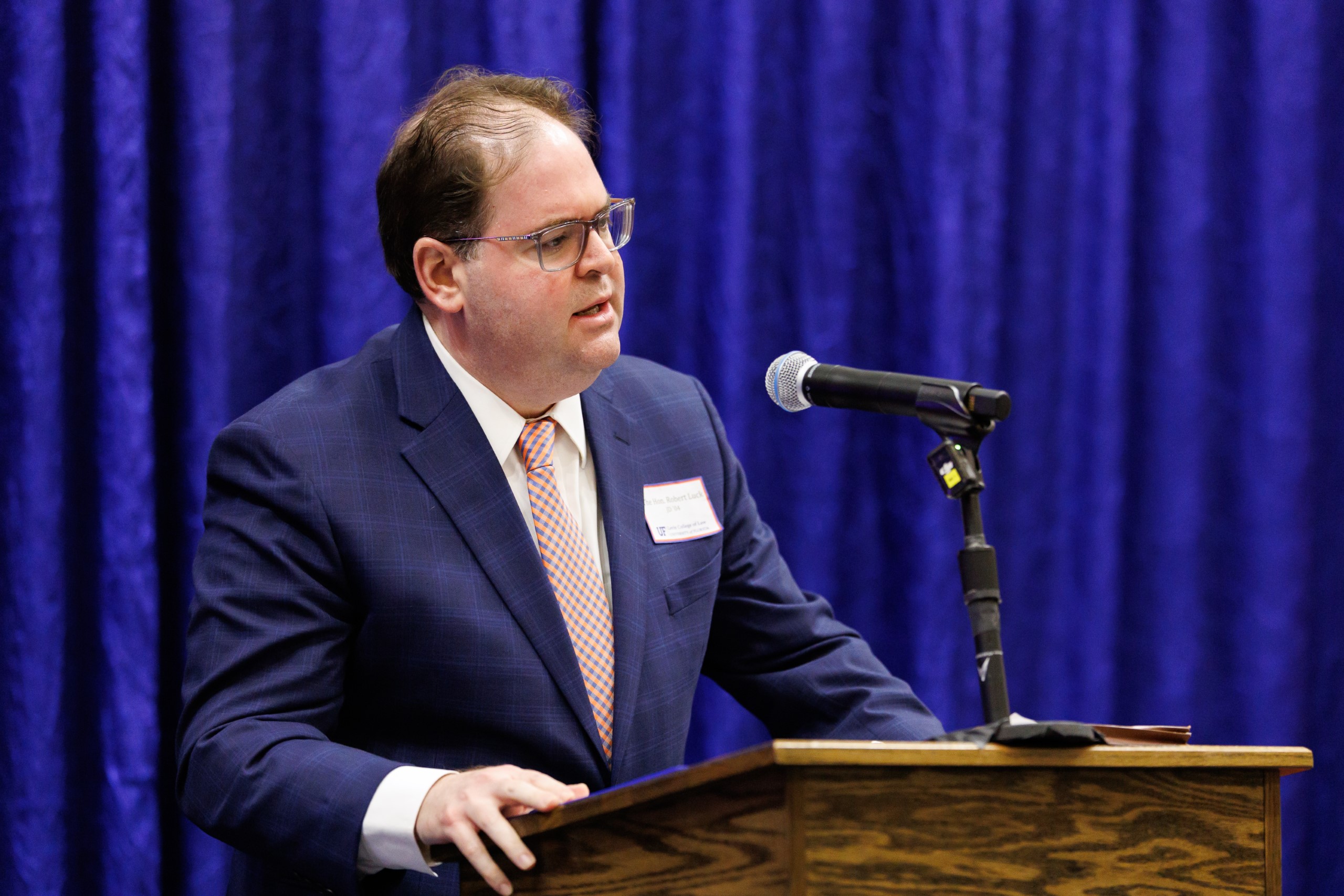 Judge Robert Luck (JD 04), U.S. Circuit Judge, U.S. Court of Appeals for the 11th Circuit, speaks at the celebration reception for UF Law's Professor Dennis Calfee and his 50 years of service to the law school. Judge Luck and Judge Kathryn Kimball Mizelle (JD 12), District Judge, U.S. District Court for the Middle District of Florida, served as the Masters of Ceremony at the Friday, November 15 event.